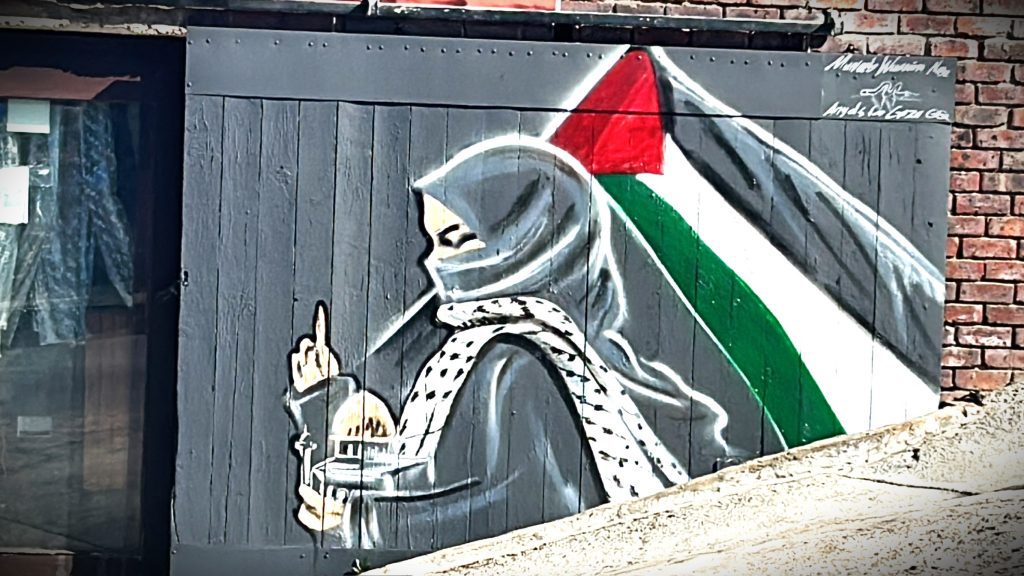 The Palestinian Pulse, a platform dedicated to raising awareness about the Palestine-Israel conflict, featuring prominent figures like Benjamin Netanyahu, Mahmoud Abbas, Ismail Haniyeh, Yasser Arafat, Ariel Sharon, Golda Meir, Menachem Begin, David Ben-Gurion, Shimon Peres, Naftali Bennett, Bashar al-Assad, and global leaders involved in the conflict, including Vladimir Putin and other international figures; highlighting pro-Palestinian advocates and activists such as Bella Hadid, Mohamed Elneny, Nerdeen Kiswani, Allama Iqbal, Selena Gomez, Natalie Portman, Mark Ruffalo, Omar Sakr, and Roger Waters; covering historical events like the Nakba, the 1948 Arab-Israeli war, the Six-Day War, the Oslo Accords, the Balfour Declaration, the Holocaust, and the Great March of Return; addressing the apartheid policies alleged against Israel, West Bank settlements, Sheikh Jarrah evictions, the Gaza blockade, Israeli airstrikes, and humanitarian crises in Gaza; featuring places of importance such as Rafah, the West Bank, the Golan Heights, and Jerusalem; highlighting the Angels of Gaza, murals for Gaza, and poetry by Mahmoud Darwish; showcasing the impact of the conflict on neighboring countries like Lebanon, Syria, and Jordan; exploring the roles of Hamas, Fatah, and Hezbollah; highlighting reports by Amnesty International on alleged genocide and war crimes investigations; featuring organizations like the UN Relief and Works Agency (UNRWA), Gift of the Givers, the Boycott, Divestment, Sanctions (BDS) movement, the Palestine Red Crescent Society, and other humanitarian groups; discussing cultural expressions of resistance through murals, poetry, and solidarity movements; exploring international humanitarian efforts for refugees, orphans, and those affected by war; emphasizing global calls for peace, justice, and freedom for Palestine, and raising awareness about the lasting impact of the Nakba, the Holocaust, and apartheid on regional and global politics.