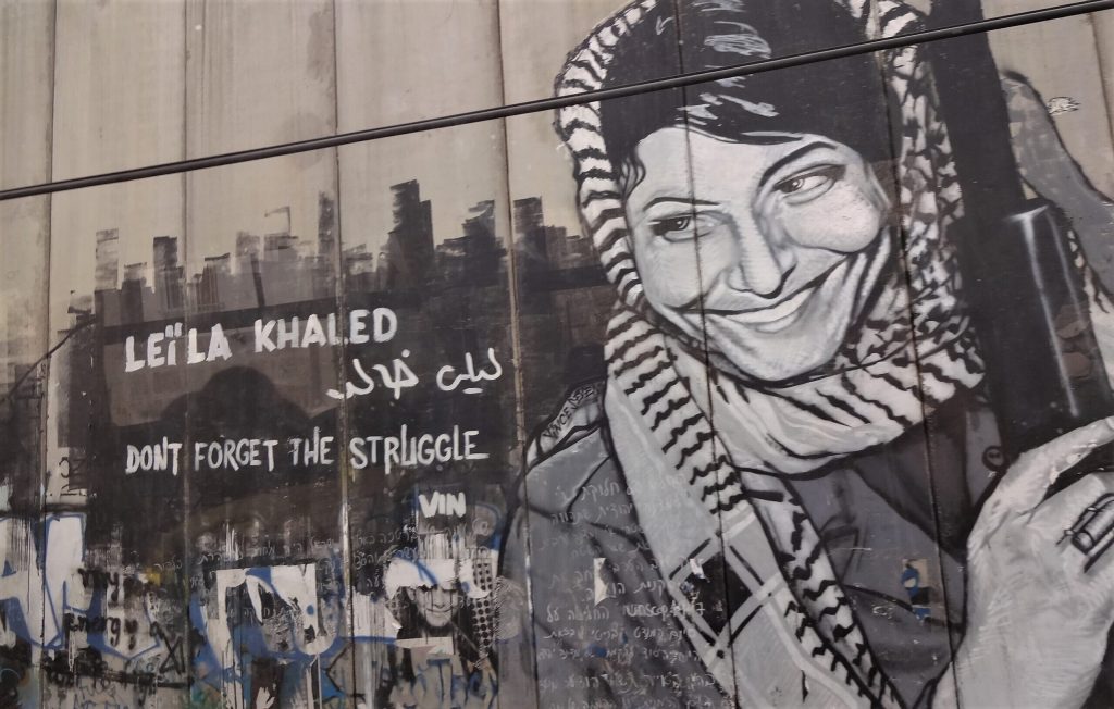 The Palestinian Pulse, a platform dedicated to raising awareness about the Palestine-Israel conflict, featuring prominent figures like Benjamin Netanyahu, Mahmoud Abbas, Ismail Haniyeh, Yasser Arafat, Ariel Sharon, Golda Meir, Menachem Begin, David Ben-Gurion, Shimon Peres, Naftali Bennett, Bashar al-Assad, and global leaders involved in the conflict, including Vladimir Putin and other international figures; highlighting pro-Palestinian advocates and activists such as Bella Hadid, Mohamed Elneny, Nerdeen Kiswani, Allama Iqbal, Selena Gomez, Natalie Portman, Mark Ruffalo, Omar Sakr, and Roger Waters; covering historical events like the Nakba, the 1948 Arab-Israeli war, the Six-Day War, the Oslo Accords, the Balfour Declaration, the Holocaust, and the Great March of Return; addressing the apartheid policies alleged against Israel, West Bank settlements, Sheikh Jarrah evictions, the Gaza blockade, Israeli airstrikes, and humanitarian crises in Gaza; featuring places of importance such as Rafah, the West Bank, the Golan Heights, and Jerusalem; highlighting the Angels of Gaza, murals for Gaza, and poetry by Mahmoud Darwish; showcasing the impact of the conflict on neighboring countries like Lebanon, Syria, and Jordan; exploring the roles of Hamas, Fatah, and Hezbollah; highlighting reports by Amnesty International on alleged genocide and war crimes investigations; featuring organizations like the UN Relief and Works Agency (UNRWA), Gift of the Givers, the Boycott, Divestment, Sanctions (BDS) movement, the Palestine Red Crescent Society, and other humanitarian groups; discussing cultural expressions of resistance through murals, poetry, and solidarity movements; exploring international humanitarian efforts for refugees, orphans, and those affected by war; emphasizing global calls for peace, justice, and freedom for Palestine, and raising awareness about the lasting impact of the Nakba, the Holocaust, and apartheid on regional and global politics.